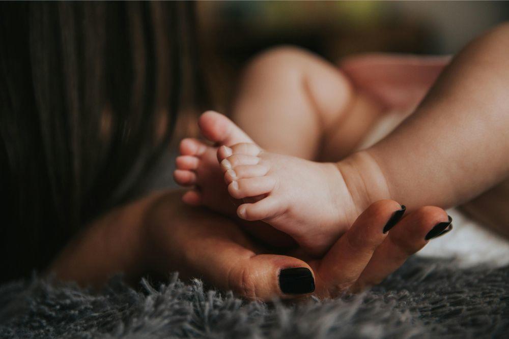 Invity Love the Skin you're in Mother cradling baby's foot. Pexels.com/ Pixabay